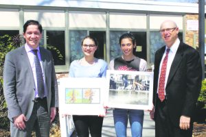 Students Kristen Clark (second from left) and Lauren Gruber are congratulated here by Principal Dr. Giovanni Durante (far left) and district coordinator of fine and performing arts Michael Salzman.