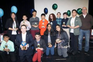 The Jericho Middle School Geography Bee participants show off their trophies.