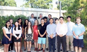 Back row, from left: Syosset High School Assistant Principal Christopher Ruffini, Superintendent of Schools Dr. Thomas Rogers and Principal Dr. Giovanni Durante congratulate the school’s National Merit Scholarship semifinalists.