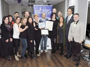 The staff at Monroe Dean Salon with their citation from the Town of Oyster Bay.