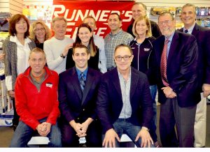 Pictured standing from left: Triathlon coordinators Linda Ottaviano and Mindy Davidson, Runner’s Edge proprietor Bob Cook and his daughter Allison, triathlon co-director Ray Farrell, triathlon sponsor chiropractor Dr. Larry Lembo, Greg Carman of triathlon sponsor Carman, Callaghan & Ingham LLP, Sue Cook of the Runner’s Edge, GLIRC President Mike Polansky, Oyster Bay Town Councilman Joe Muscarella. Seated from left: Doug Williamson of triathlon sponsor Babylon Bike Shop, Dr. John DeGorter of triathlon sponsor Jonas Chiropractic and Steve Kristel of triathlon sponsor Bo’s Kitchen and Bar Room.