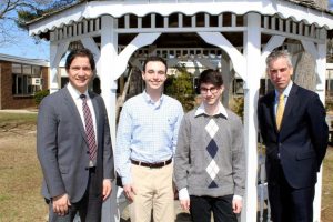 Syosset Principal Dr. Giovanni Durante congratulates salutatorian Michael Collet and valedictorian Benjamin Senzer along with Superintendent of Schools Dr. Thomas Rogers. (Photo by Syosset Schools)