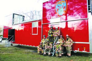 From left (top row): Ex-Chief George Motchkavitz, 2nd Asst. Chief John Purcell; (center row): Firefighter Dave Hertz, Safety Officer Mike Green, Captain Carlos Gallo; (bottom row): Former Chief and 1st Lieutenant Ray Plakstis, Jr., 1st Asst. Chief Steve Schwartz, Chief James Neubert