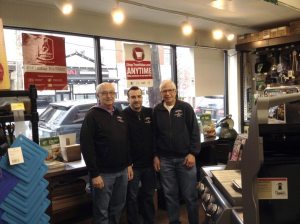 Adam Novick, center, flanked by his father Mark Novick, on his left, and uncle Lou Cohen, on his right.