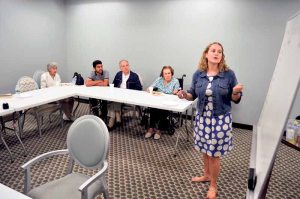Lindsay Knudsen, director of late stage programming and social worker for LIAF, leads a word association activity.