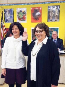 Donna Peirez (right) is sworn in as Board of Education trustee by Michele Domanick. (Photo by Joseph Catrone)