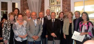 The board, from left: ) Marie Marcellino (Mainly Marketing,) David Heller (Golden Hands Massage Therapies,) Mariann Dalimonte (BID,) Jerry Rudnick (Kiwanis,) Ayhan Hassan (Ayhan’s Mediterranean Restaurants,) Kenneth Magida, Esq., Bill Gordon (LI Boat Rentals,) Carl Lalena (Kiwanis,) Leslie Ann Jacobi (TD Bank,) Beth Fiore (Graphicworks,) Hal Linden (Scheinman Properties,) and Councilwoman Dina DeGiorgio