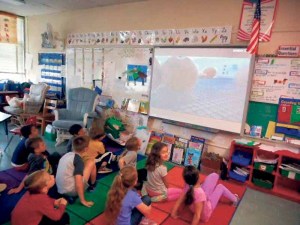 Second-grade students observe chicks hatching right in their classroom.