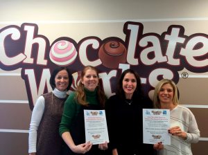Pictured from left: Cathy Conniff, Munsey Park SCA president, Stephanie Solomon, owner of Chocolate Works in Manhasset; Caryn Sawyer, Manhasset CASA executive director; and Leslie Fleck, Shelter Rock SCA president.