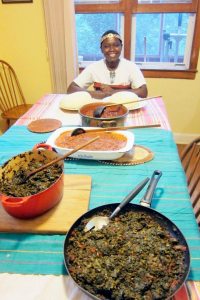 (From front back) Mboga-sukumawiki, mustard greens, romano bean stew with olive oil, onions and tomatoes, gather (maize and beans) and ugali.
