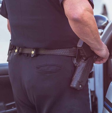 Police officer getting out of cruiser