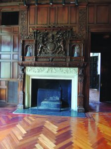 The detail is remarkable on the original hand-carved fireplace.