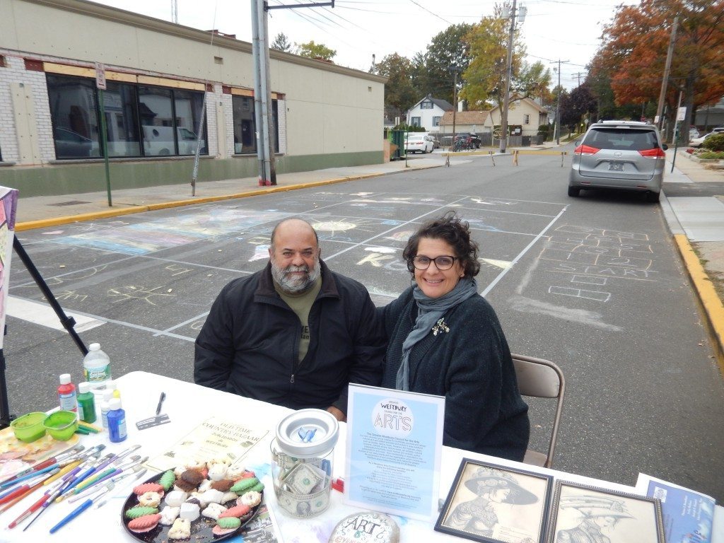The Greater Westbury Council for the Arts had a street chalk mosaic set up for attendees to decorate