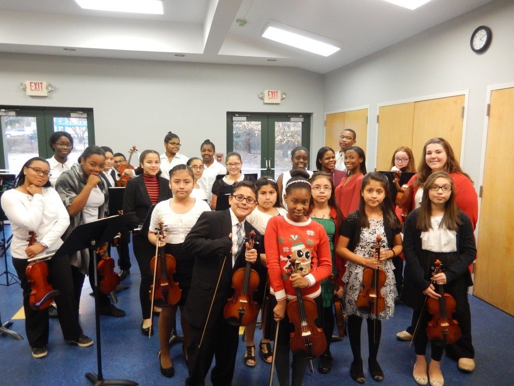Westbury Middle School orchestra students played "Jingle Bell Rock" at the tree lighting ceremony.