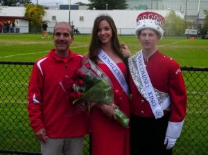 Principal Ed Escobar with Homecoming king and queen Joseph Wales and Jenna Parenti