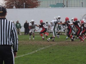 Dominic Paggi, tackles Luis Costa