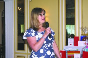 Womens Club Vice President Daria Connolly welcomes luncheon guests.