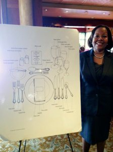 Linda WIlliams with a display on the proper place settings.