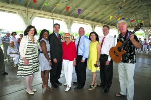 From left: Councilwoman Lee Seeman, Councilwoman Viviana Russell, Town Clerk Wayne Wink, Supervisor Judi Bosworth, Councilman Peter Zuckerman, Councilwoman Anna Kaplan, Receiver of Taxes Charles Berman and FunDay Monday performer Richard Mattes of Sweet Lorraine