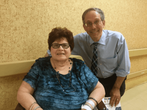 Pictured at the festivities are resident Francine McGovern and Rabbi Michael Klayman.