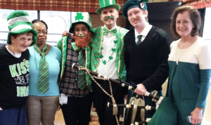 From left: Eileen Delgenio, resident; Velma Crawford, recreational therapist; Francesca Welhous, recreational therapist; David Sterling, assistant director of Therapeutic Recreation; Patrick Roniger, bagpiper; Mayor Jean Celender