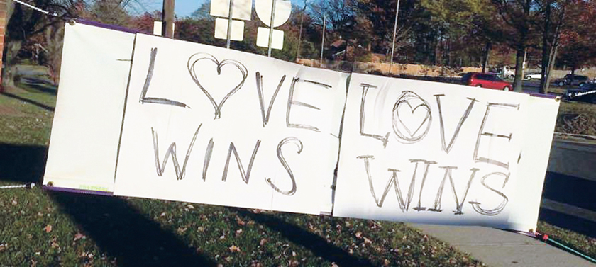 After a church’s sign was defaced with racist rhetoric, church members came together to cover it up with a message of love. (Photo by the Episcopal Diocese of Washington)