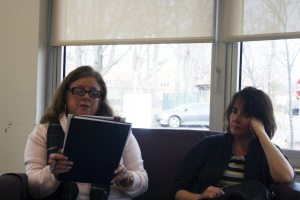 A member reads her story during the workshop