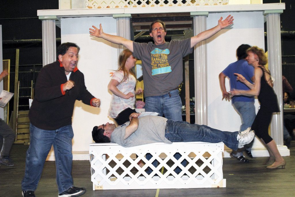Actors rehearse a scene from A Funny Thing Happened on the Way to the Forum