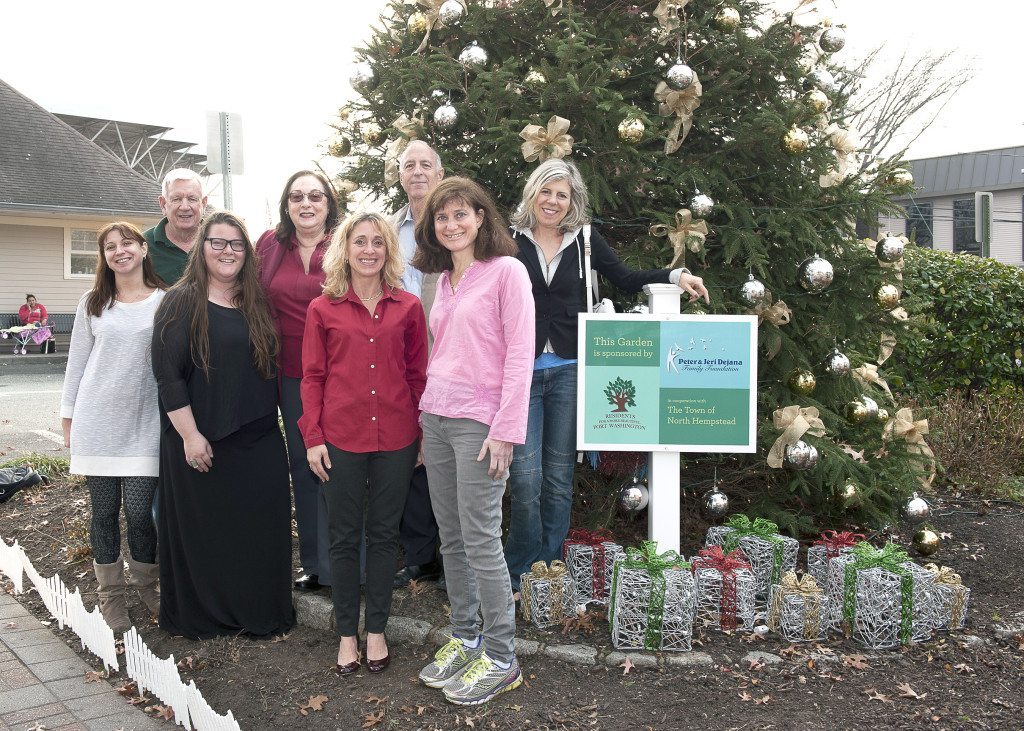 Image 1”Holiday Tree” Bottom row, left to right: Jessica Haas of Port Washington Florist, Model Blocks Street Art Co-chair Dvora Troshane, Residents Executive Director Mindy Germain and Model Blocks Chair Jennifer Rimmer Top row, left to right: Fred Falconer of S.F. Falconer Florist, Annette Oestreich Residents VP of Finance/Model Blocks Chair of Façade Aid, Dan Donatelli Residents Co-President/Model Blocks Committee member, Michelle Shain Designer of Headlights Creative