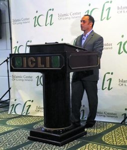 Rais Bhuiyan speaks to a crowd at the Islamic Center of Long Island.