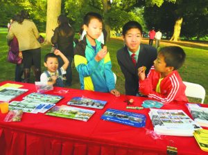 From left: Sons Daniel, Jackey, Robert and Enoch are eating Moon Cakes at the Mid-Autumn Festival at Old Westbury Gardens.