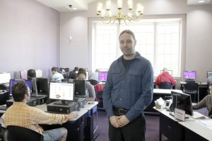 James Hutter in the library's computer room