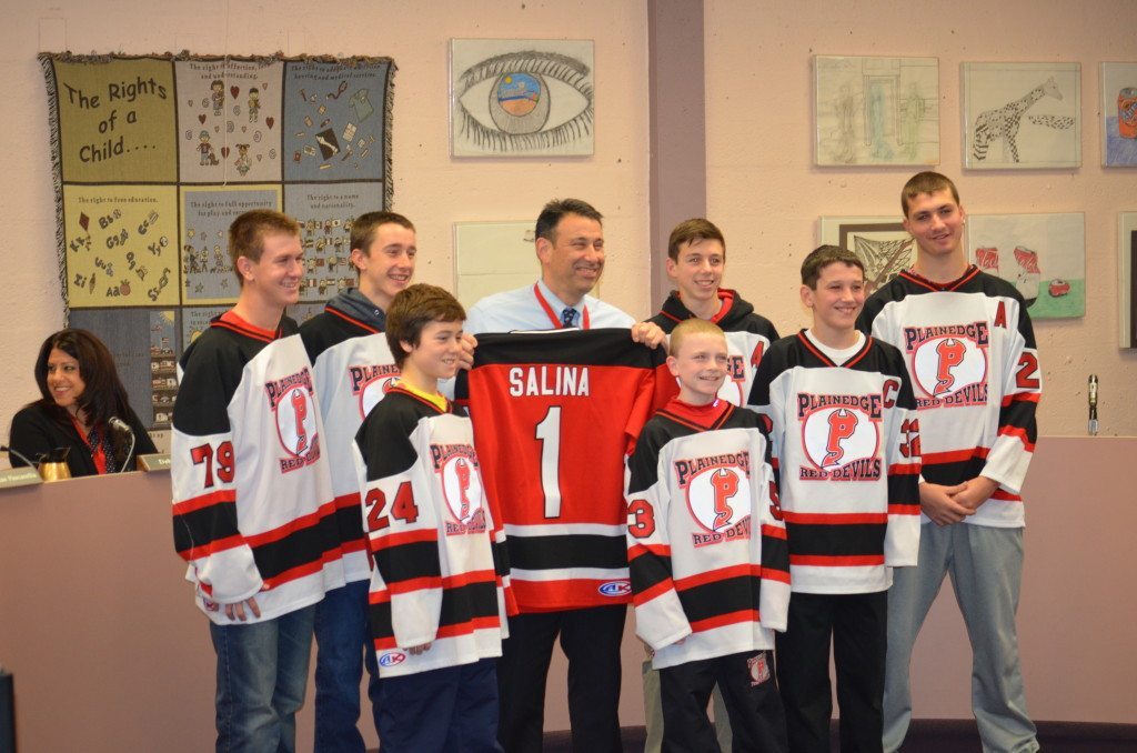 Plainedge Hockey Team Presents Jersey to School Superintendent Salina