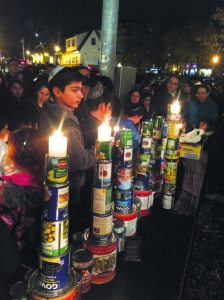 Children from Chabad of Great Neck constructed a menorah out of the cans donated from a recent food drive. 
