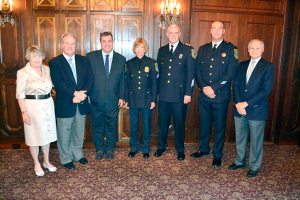 Village trustee Kay Ullman, Police Commissioner Marc Silbert, Deputy Mayor Peter Forman, Sergeant Christina Howes, new Chief of Police Richard Lertora, Lieutenant Thomas Ruehle and Mayor Edward Adler.