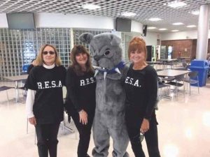 From left: representing the Roslyn Educational Secretaries Association (RESA), Susan Doyle, Rebecca Eger and Andrea Rubin came out to participate in Roslyn High School’s Homecoming celebration on Saturday, Sept. 24. 