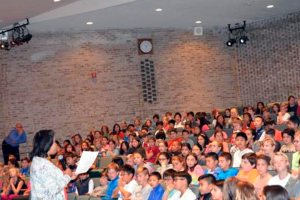 Shelter Rock Assistant Principal Paulette Williams describing Red Ribbon week to the students