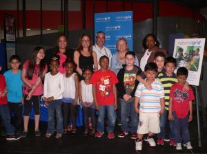 Back row (L-R) Michelle Peterson- Assistant Principal, Lauren Perry and Lee Westerlind, both of Community & Customer Management National Grid, Suzanne LeBlanc, LICM President and Gloria Dingwall, Principal of Park Avenue Elementary School with elementary school students.  