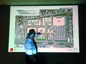 John R.Clifford, an architect employed by S9 Architecture of New York City, points to a preliminary site plan. (Photos by Chris Boyle)