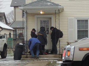 Police are investigating a Mineola shooting outside this Roslyn Road home this morning. (Photo by Rich Forestano)