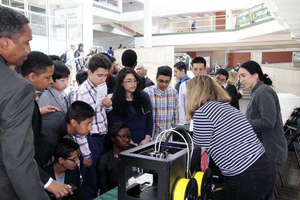 Students check out a 3D printer