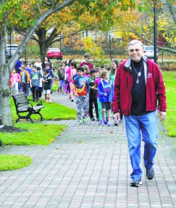 Commissioner Daniel M. Nachmanoff leads the group of students as they enter the park. (Photos by Michele Siegel)