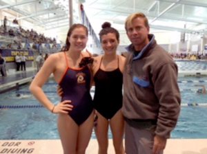 Manhasset longtime swimmers Kylie Mulholland and Grace Kenlon with Head Swim Coach Matt McGrane