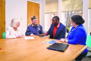 From left: Supervisor Judi Bosworth, Thomas Buzzita, Staff Sergeant Timothy Turane and caseworker Gail Selig