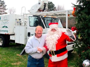 Frank Heffernin donates his services to decorate the tree every year. (And Santa helps out!)