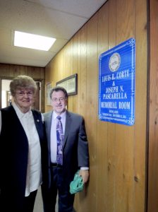 Marion Pascarella and Steve Corte in front of the newly unveiled sign
