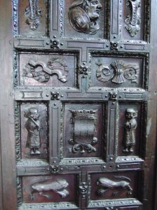 The original hand-carved wooden entry doors