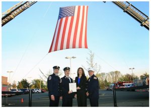 Alert Fire Department Former Chief and Board Member Ron Campbell, Chief James E. Neubert, Legislator Ellen W. Birnbaum and Second Assistant Chief John Purcell