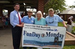 Supervisor Judi Bosworth and Town Clerk Wayne Wink are with two seniors at a Funday Monday last summer.