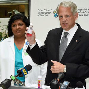 US Rep. Steve Israel and Dr. Minu George asking drug makers to include safer and more accurate dosing devices with their over-the-counter children’s liquid medication.